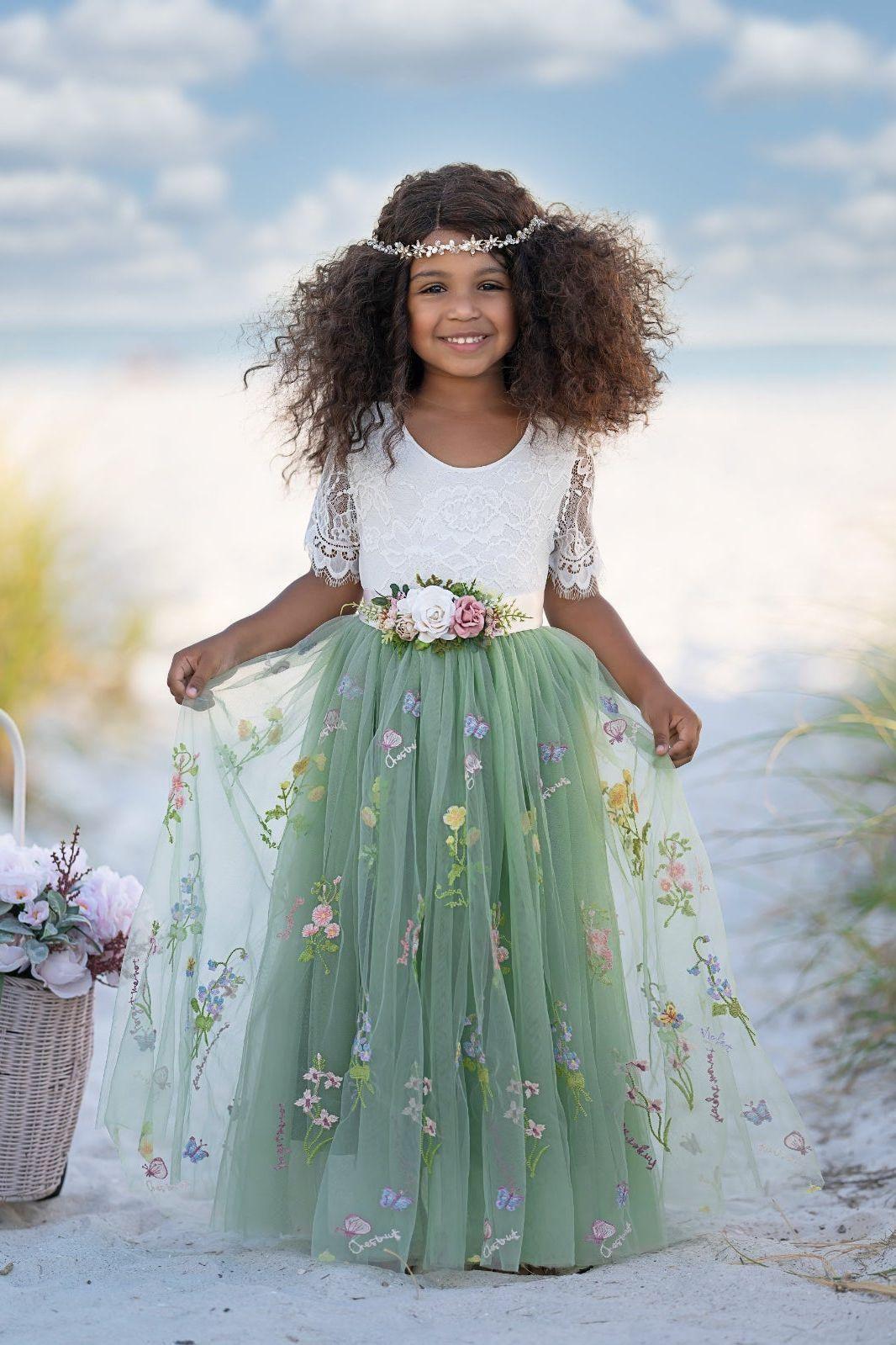 Floral embroidered toddler flower girl dress with wildflower embroidered flowers on the sage green tulle skirting. 